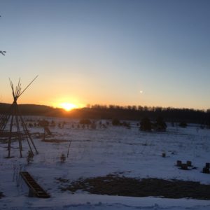 sunrise over snowy landscape