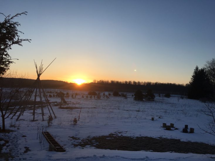 sunrise over snowy landscape